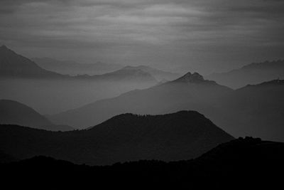 Scenic view of silhouette mountains against sky