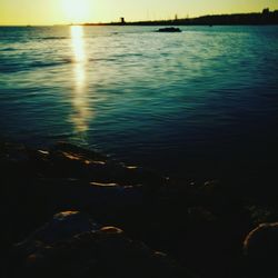 Scenic view of sea against sky at sunset