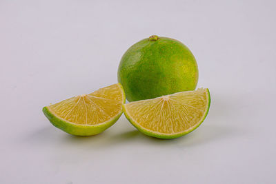 Close-up of fruits against white background