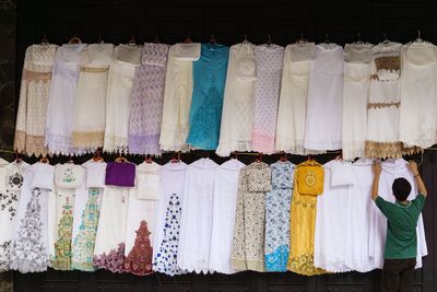 Rear view of clothes for sale at market stall