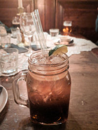 Close-up of ice cream in glass jar on table