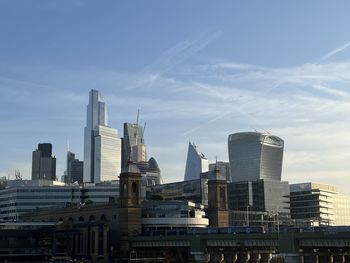 Buildings in city against sky