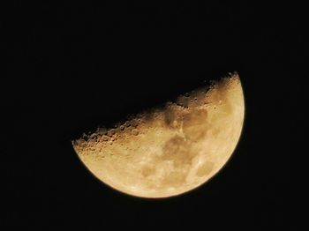 Low angle view of moon against clear sky at night