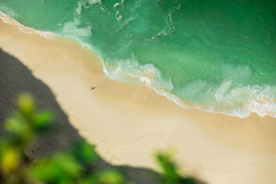 Aerial view of woman standing on beach