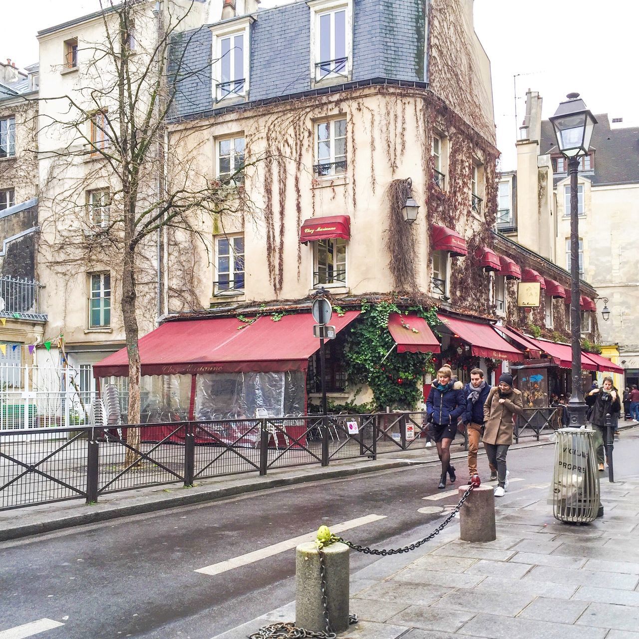 building exterior, architecture, built structure, street, city, men, person, city life, lifestyles, walking, building, residential building, residential structure, large group of people, leisure activity, day, cobblestone, road, incidental people