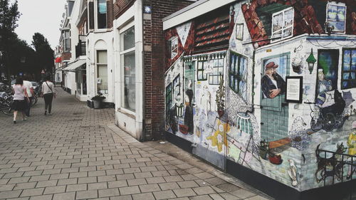 People walking on street in city