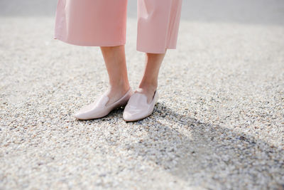 Low section of woman standing on floor