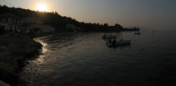 Scenic view of sea against clear sky at sunset