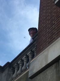 Low angle view of statue against sky in city