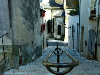 Narrow alley amidst old buildings in town