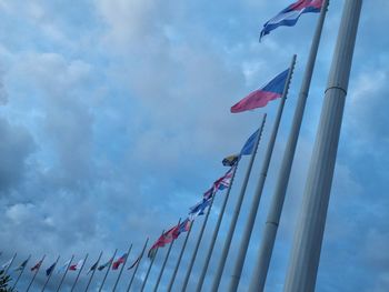 Low angle view of flag against sky