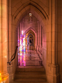 Illuminated corridor of building