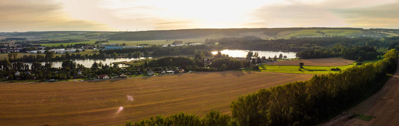 Scenic view of field against sky during sunset