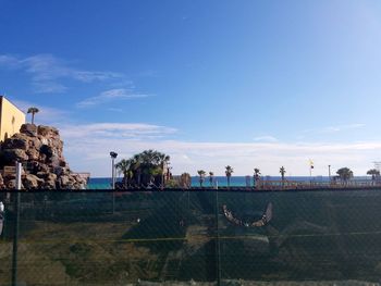 Built structure against blue sky and clouds