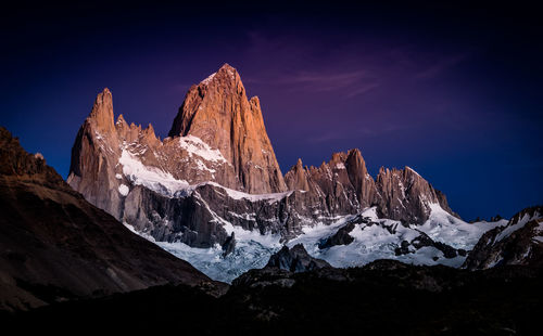 Panoramic view of snowcapped mountains against sky