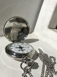 High angle view of clock on table