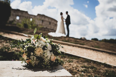 Rear view of woman standing on field