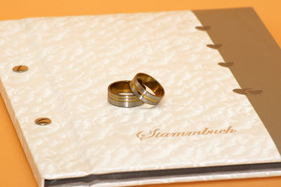 High angle view of wedding rings on table