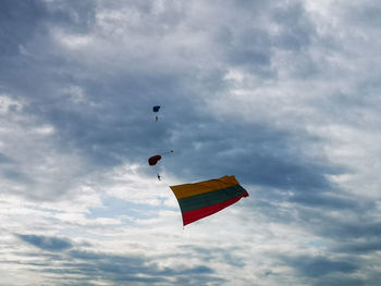 Low angle view of kite flying against sky