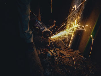 Man working on metal structure in factory