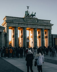 Group of people in front of historical building