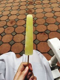 Cropped image of person holding ice cream