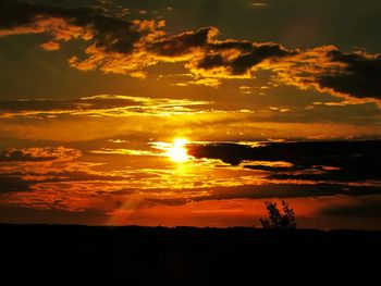 Scenic view of dramatic sky during sunset