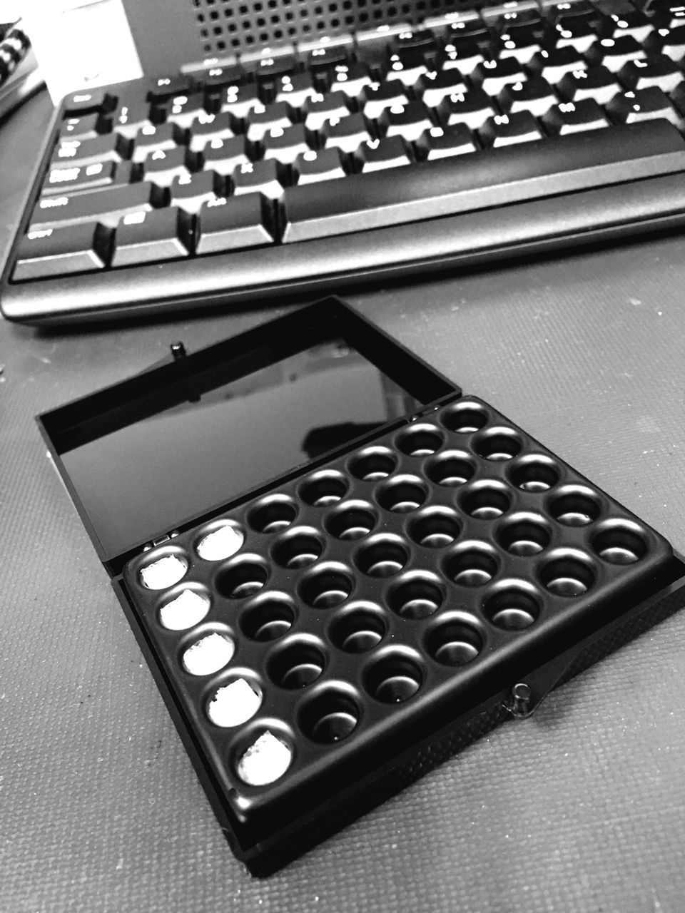 CLOSE-UP OF COMPUTER KEYBOARD ON TABLE