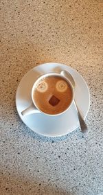High angle view of coffee cup on table
