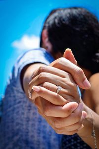 Close-up of couple holding hands