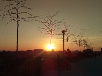 Silhouette of city during sunset