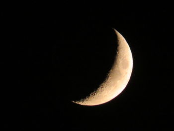 Low angle view of moon against sky at night