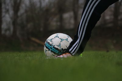 Close-up of soccer ball on field