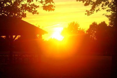 Silhouette of house at sunset