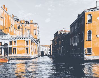 Canal passing through city buildings