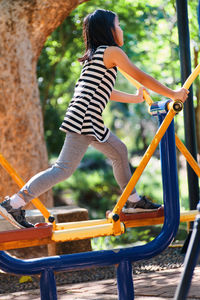 Low angle view of girl playing on playground