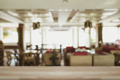 Empty chairs and tables in restaurant