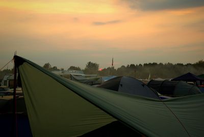 Close-up of tent against sky during sunset