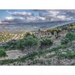 Scenic view of landscape against cloudy sky