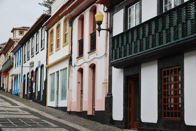 Buildings by street in city