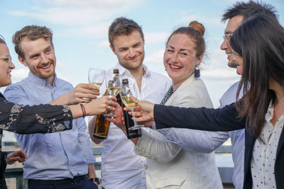 Group of people celebrating at bar