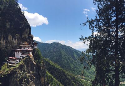 Scenic view of mountains against cloudy sky