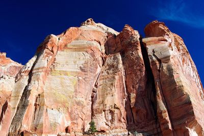 Low angle view of rock formation against sky