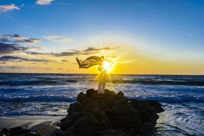 Scenic view of sea at sunset