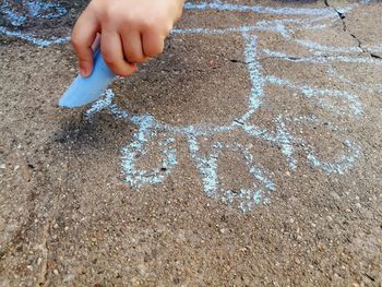 Cropped hand drawing on footpath