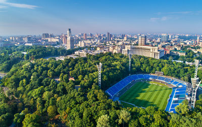 High angle view of trees and buildings in city