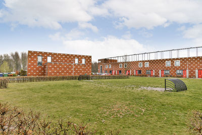 House on field against sky