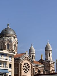 Low angle view of building against blue sky