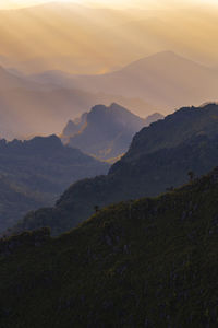 Scenic view of mountains against sky during sunset