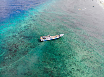 High angle view of ship sailing on sea